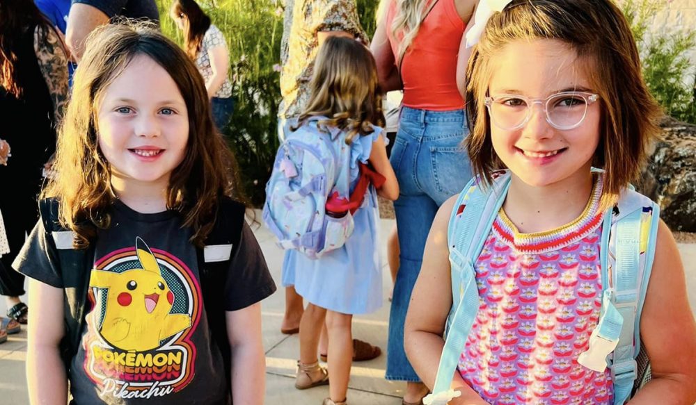 2 young girls with backpacks