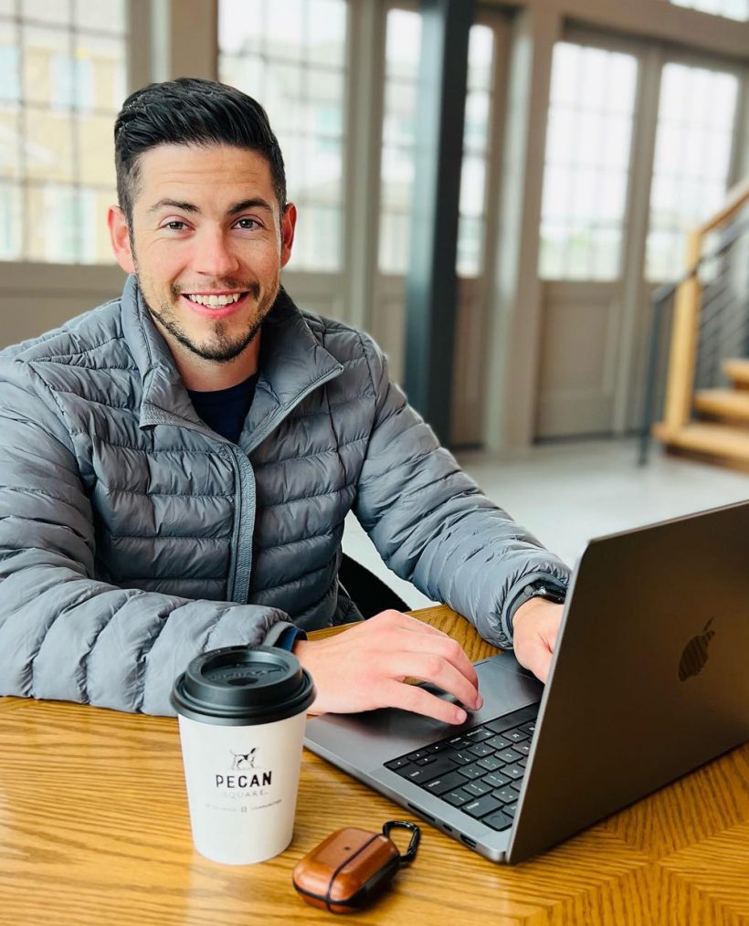 man working on his laptop drinking coffee