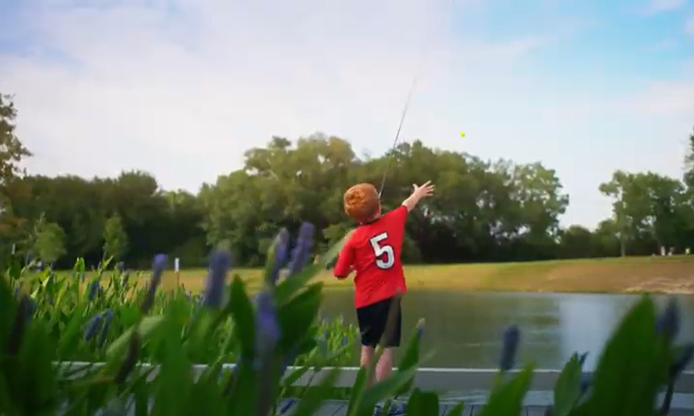 red-headed boy fishing